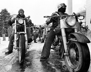 Mounted on their hogs, friends of Booger Red line up outside the funeral home.