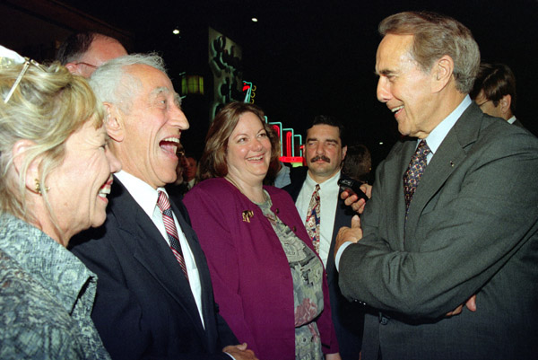 After the stare down ran its course, the normally deadpan Paulsen and usually subdue Dole share a laugh. Paulsen's wife, Noma is at far left. (Copyrighted by John S. Stewart/LEFTeyeSTORIES.com)